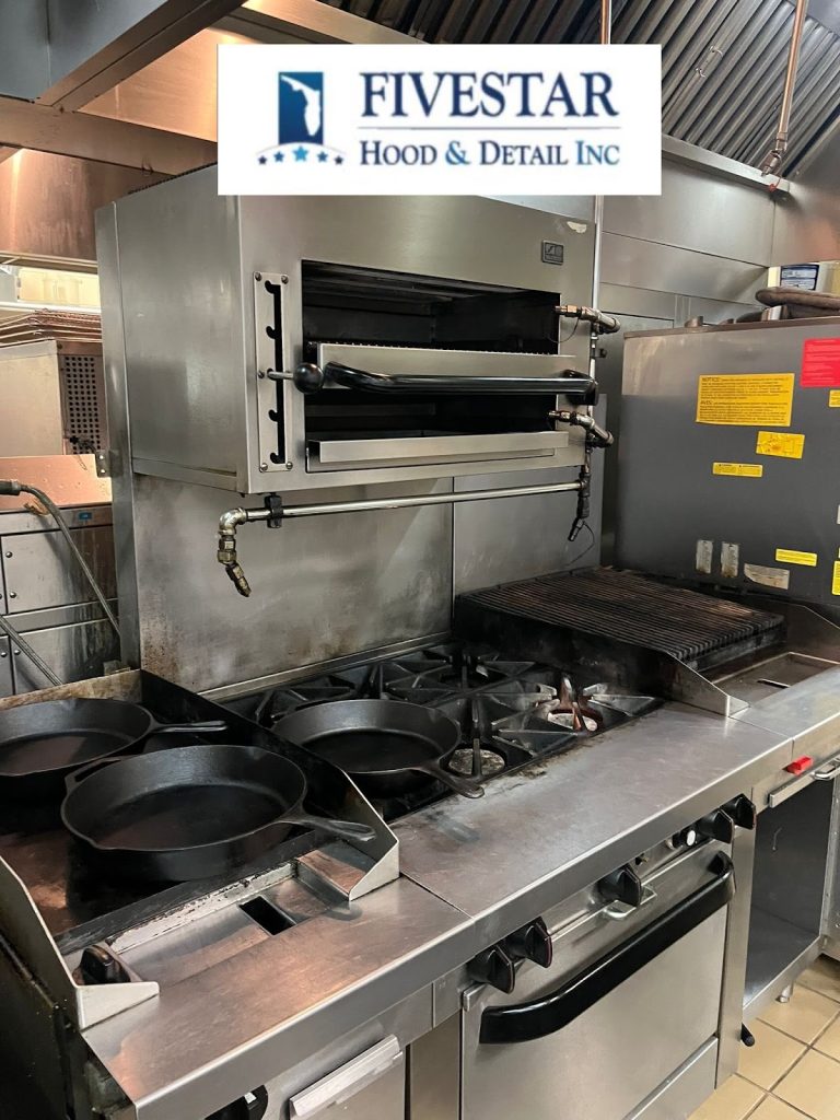 Commercial kitchen stove with multiple cast iron pans and a broiler, part of a restaurant kitchen setup, featuring a Five Star Hood & Detail Inc logo at the top.